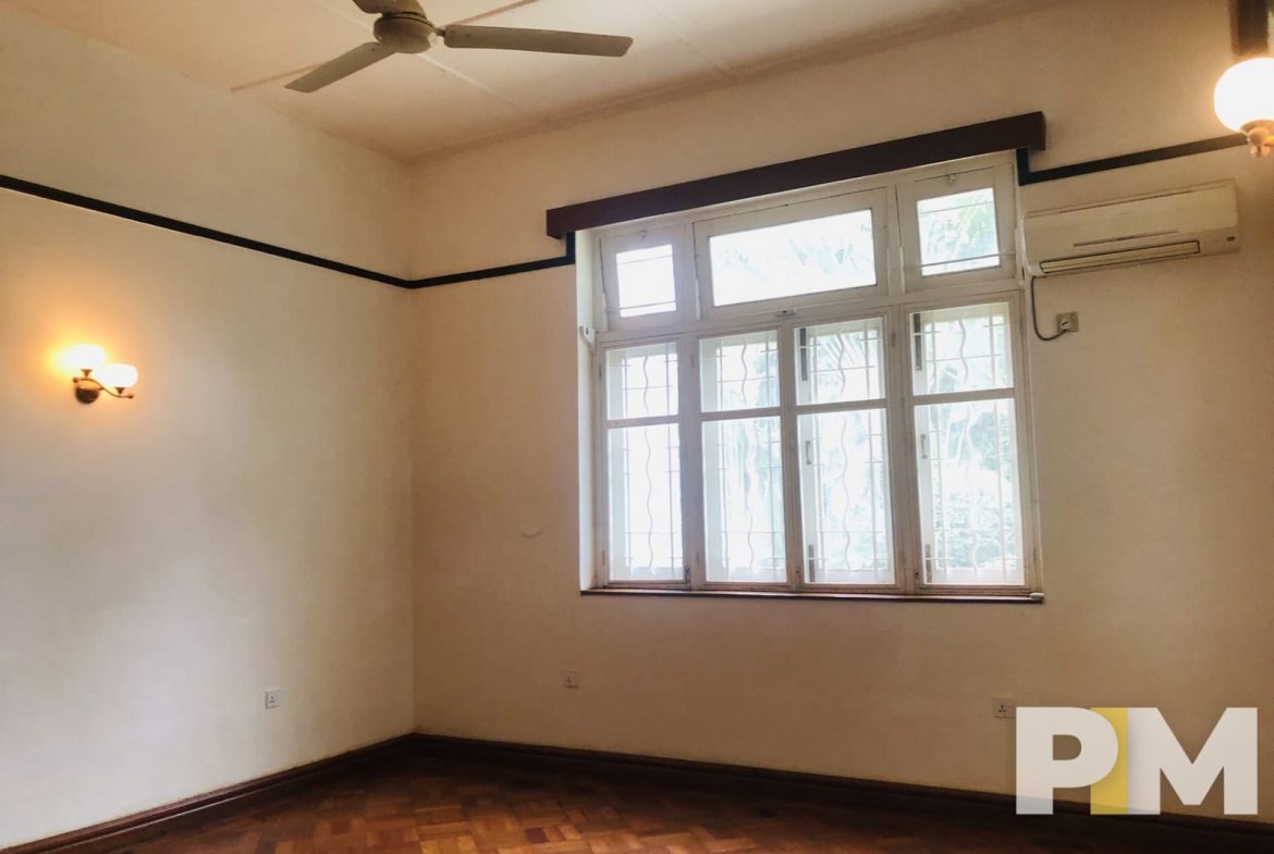 room with ceiling fan - property in Yangon