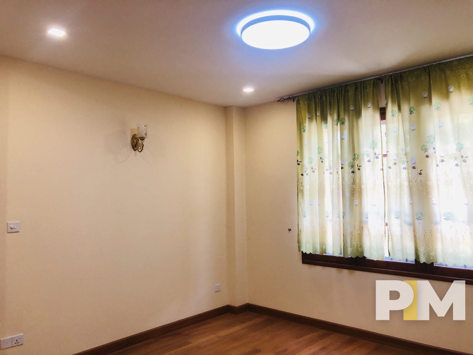 room with ceiling lighting - property in Yangon