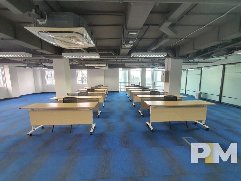 room with working desks and chairs - property in Yangon