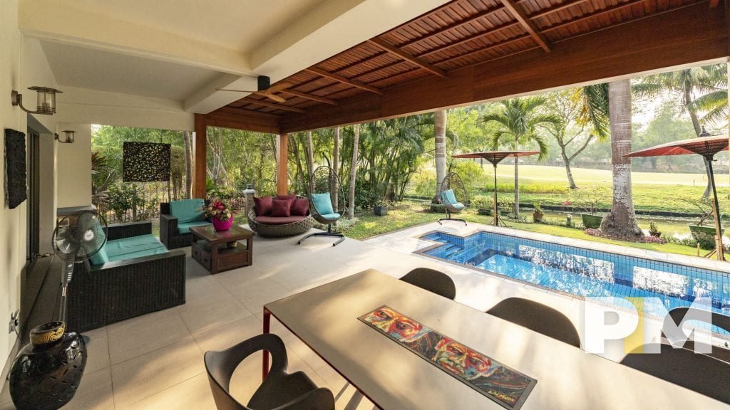 swimming pool with outdoor seats - Yangon Real Estate