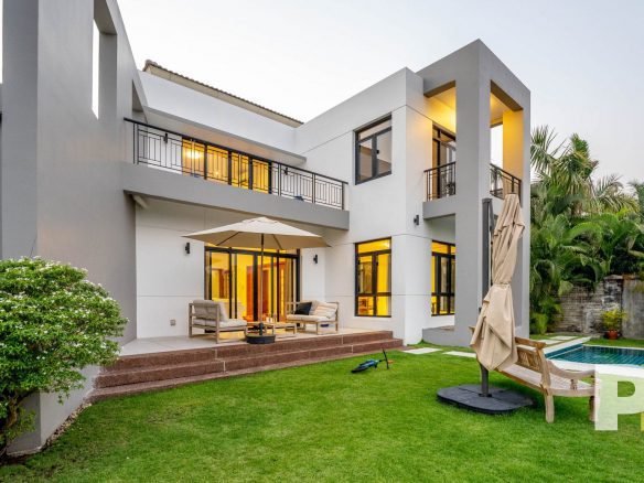 swimming pool with outdoor seats - property in Yangon