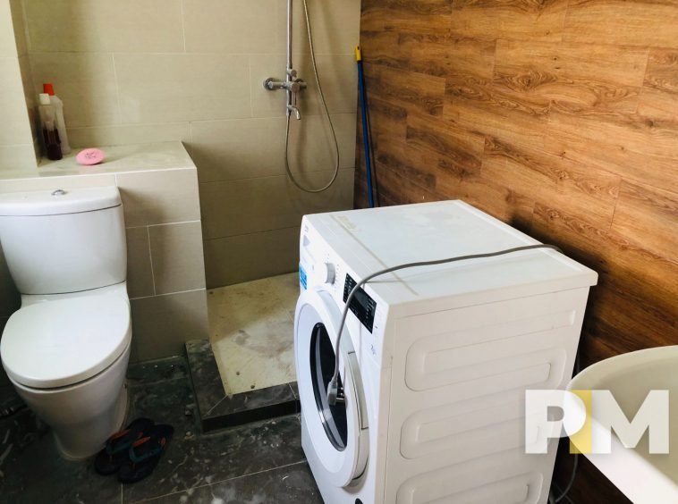 bathroom with washing machine - Yangon Property