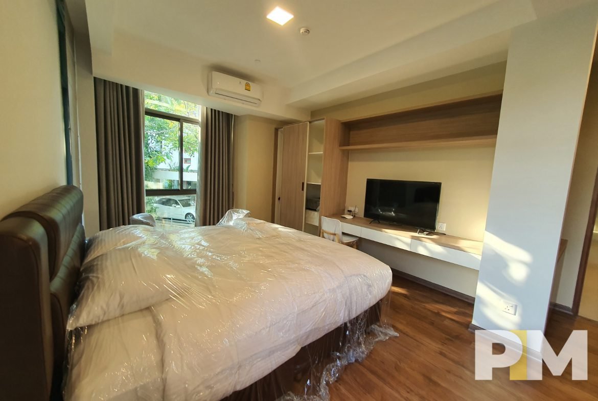 bedroom with TV - Myanmar Property