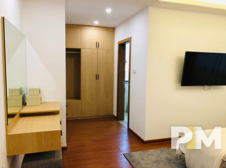 bedroom with TV - properties in Yangon