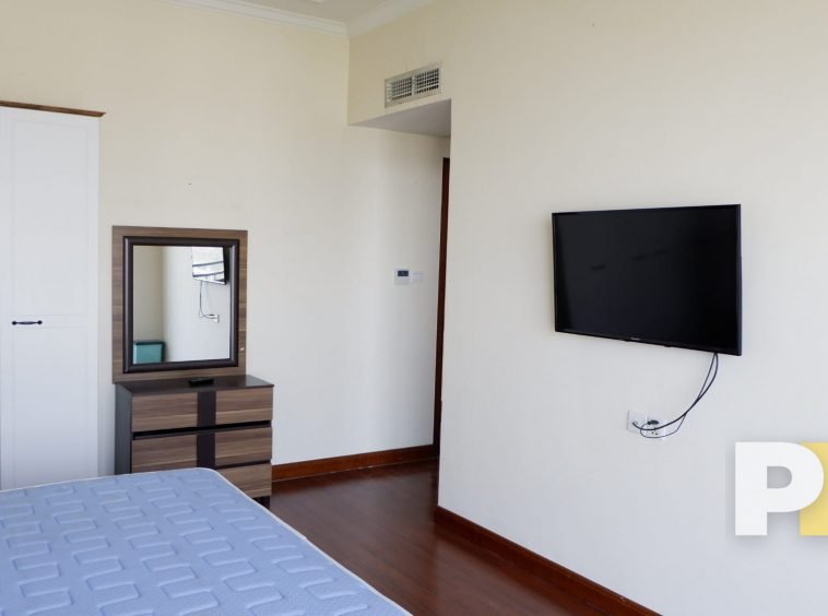 bedroom with TV - properties in Yangon