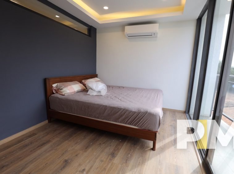 bedroom with air conditioner - Home Rental Myanmar