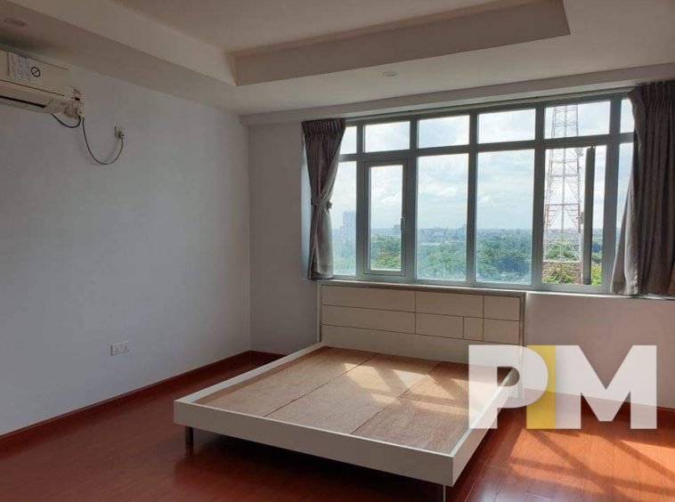 bedroom with bed - Yangon Property