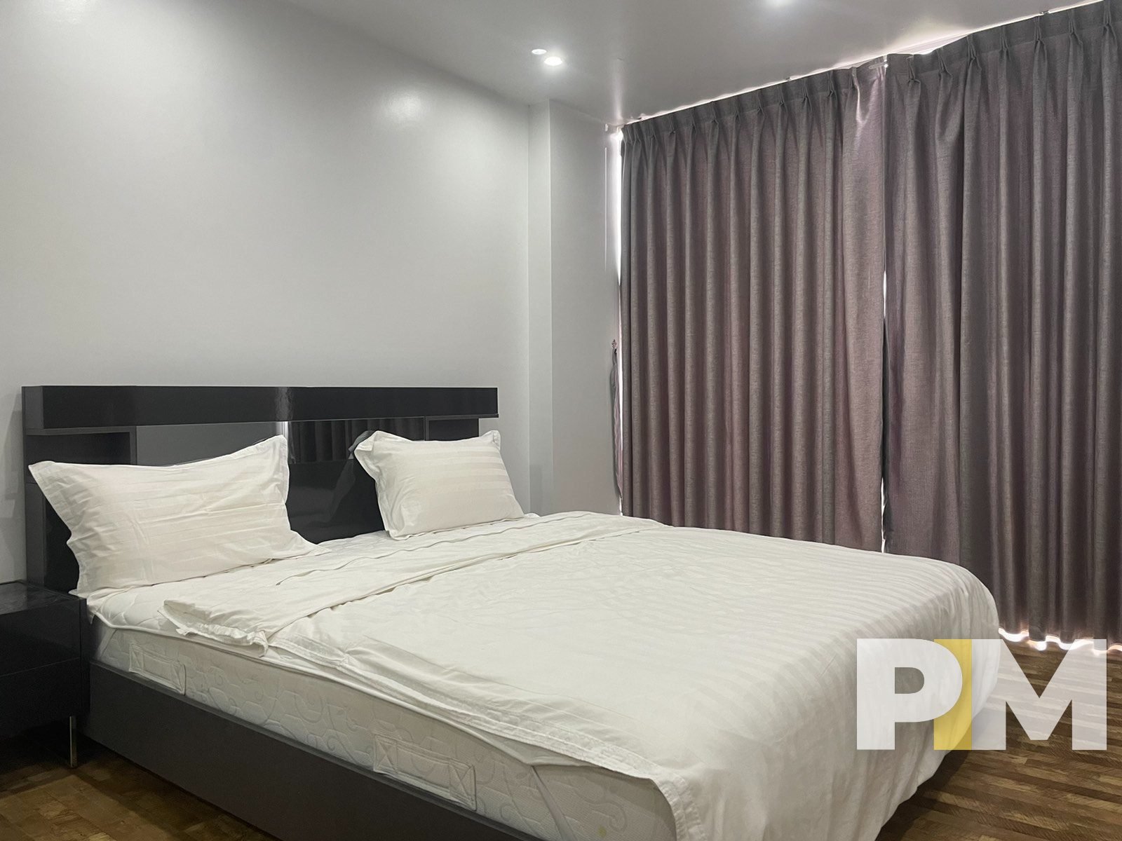 bedroom with curtains - Real Estate in Yangon