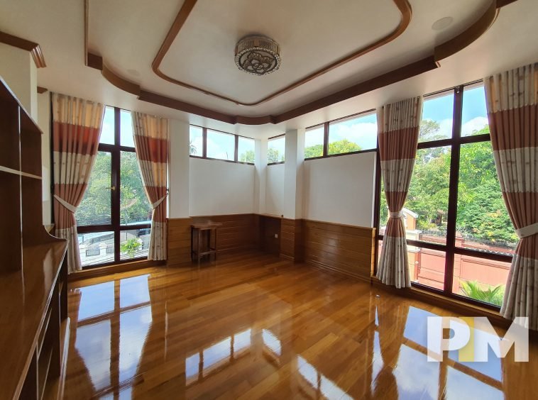bedroom with glass window - properties in Yangon