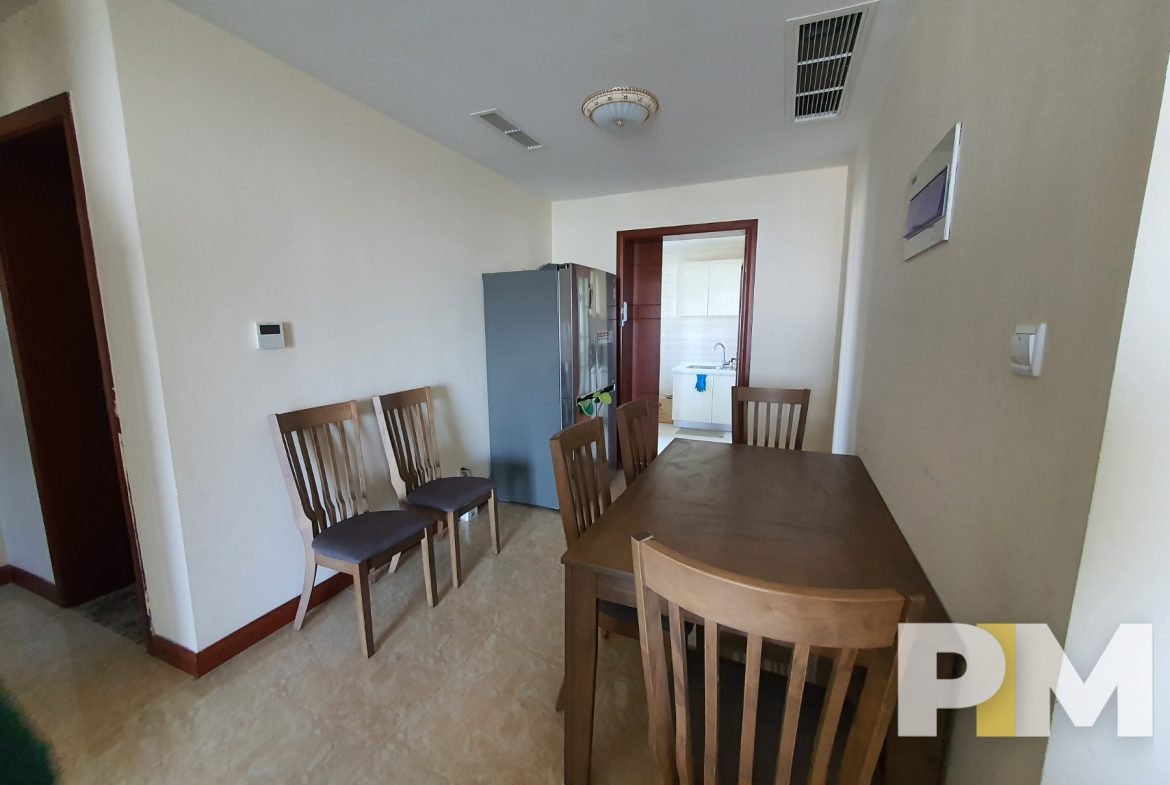 dining room with table and chairs - property in Yangon