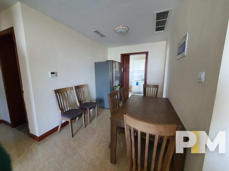 dining room with table and chairs - property in Yangon