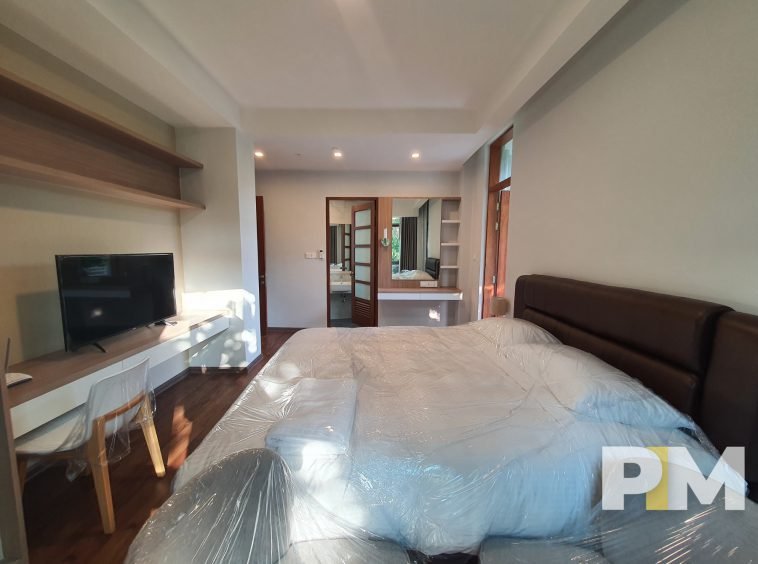 ensuite bedroom with TV - Yangon Luxury Apartments