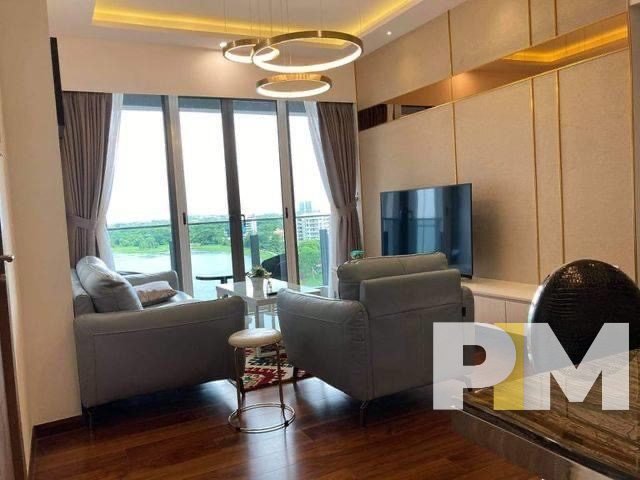 living room with large glass window - property in Yangon