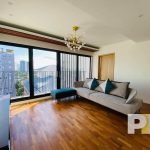 living room with large glass windows - properties in Yangon