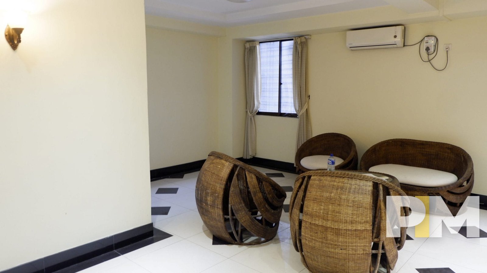 living room with rattan furniture set - Myanmar Property