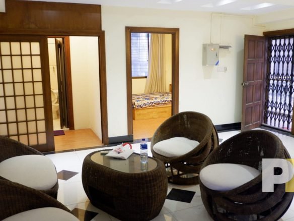 living room with rattan furniture set - properties in Yangon
