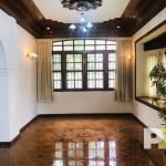 room with hanging light - property in Yangon