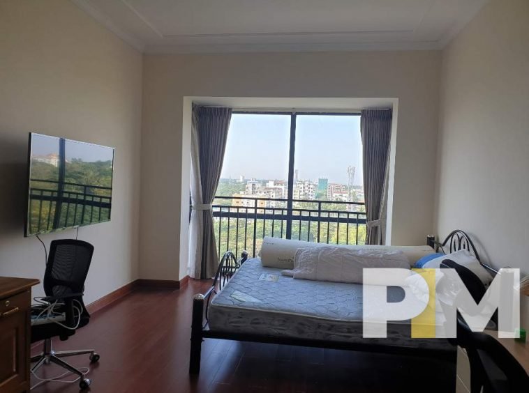 bedroom with TV - Real Estate in Yangon