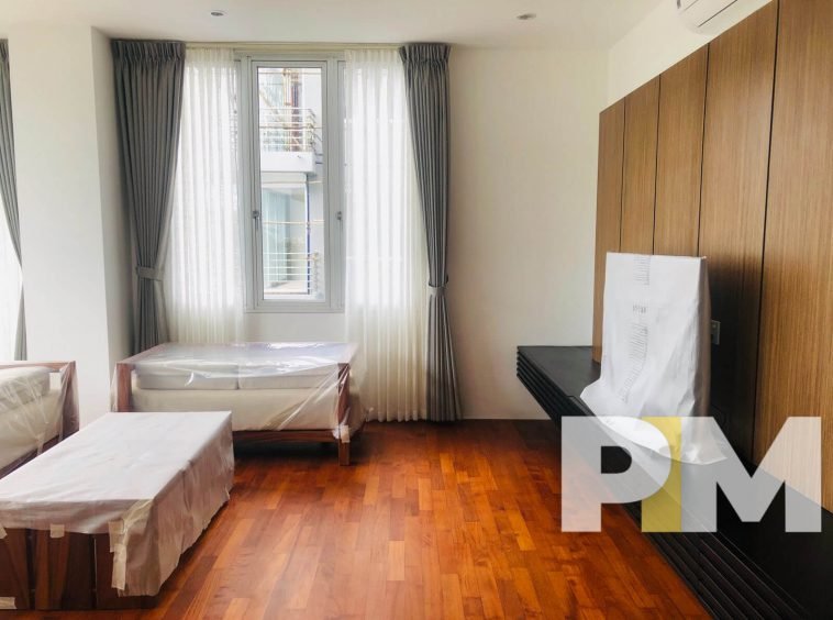 bedroom with TV - properties in Yangon