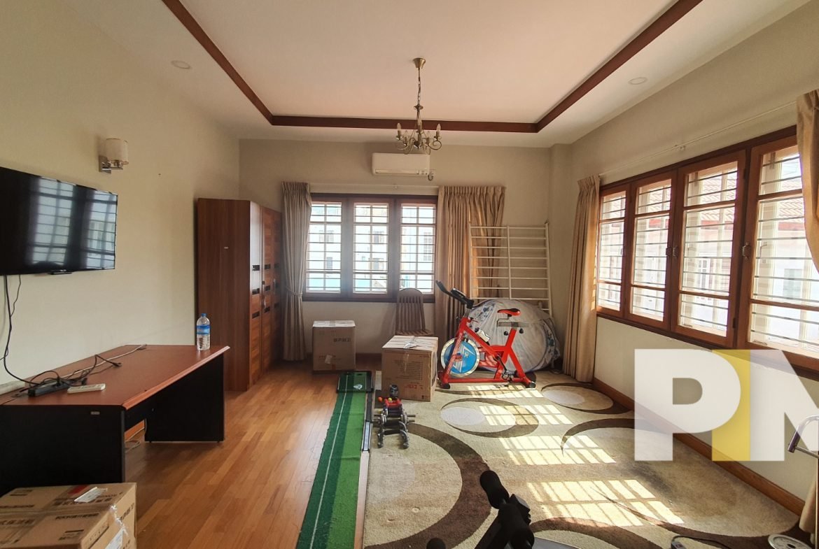 bedroom with TV - property in Yangon