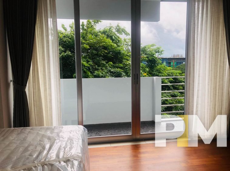 bedroom with balcony - Home Rental Yangon