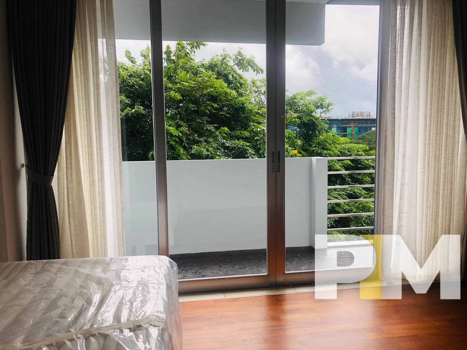 bedroom with balcony - Home Rental Yangon