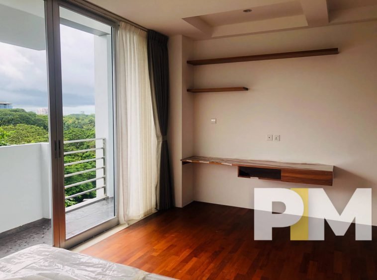 bedroom with balcony - properties in Yangon