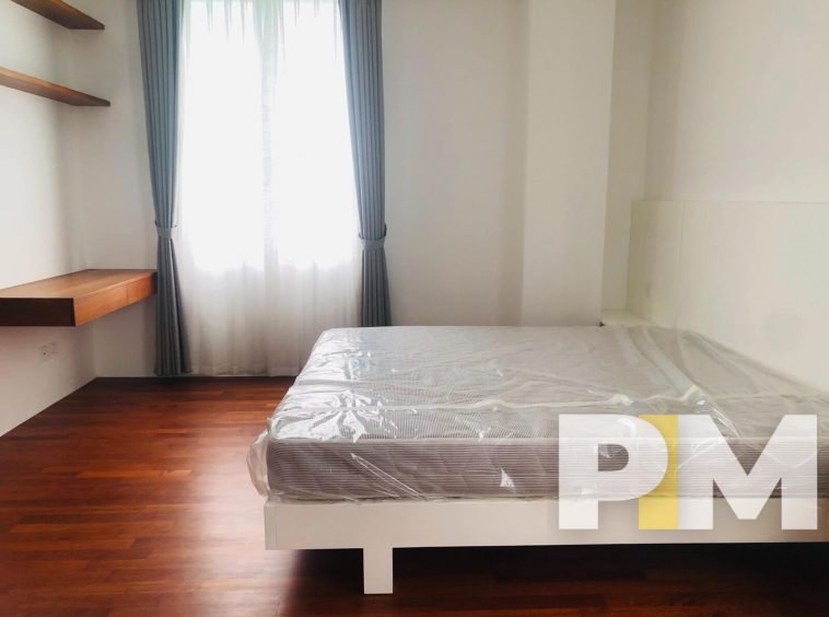 bedroom with bed and mattress - Home Rental Yangon