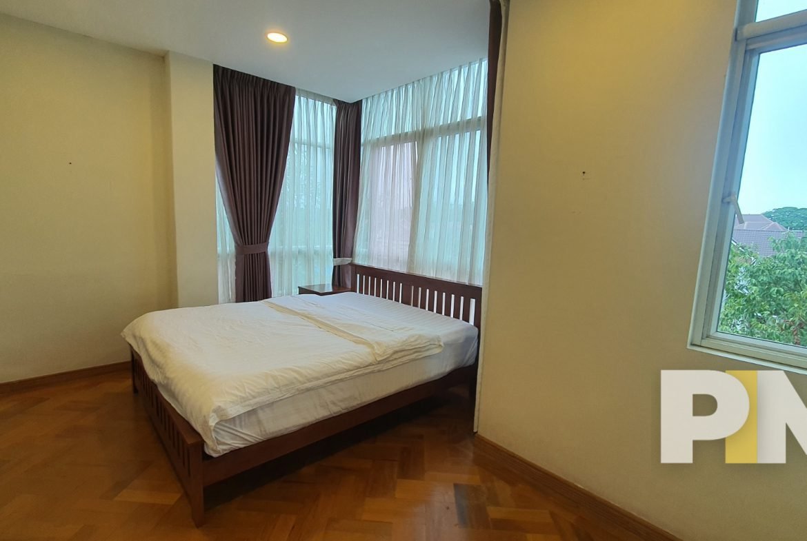 bedroom with bed and mattress - Yangon Luxury Apartment