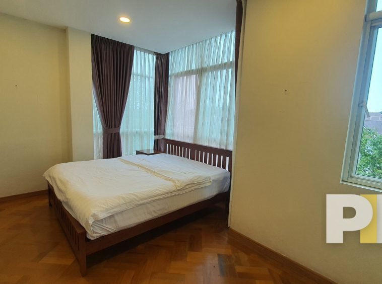 bedroom with bed and mattress - Yangon Luxury Apartment