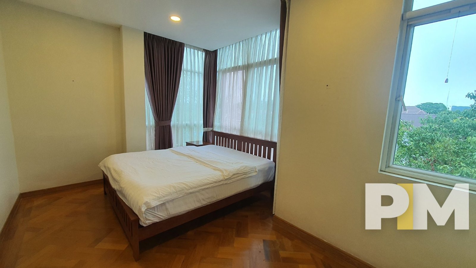 bedroom with bed and mattress - Yangon Luxury Apartment