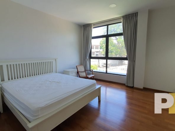 bedroom with bed and mattress - Yangon Property