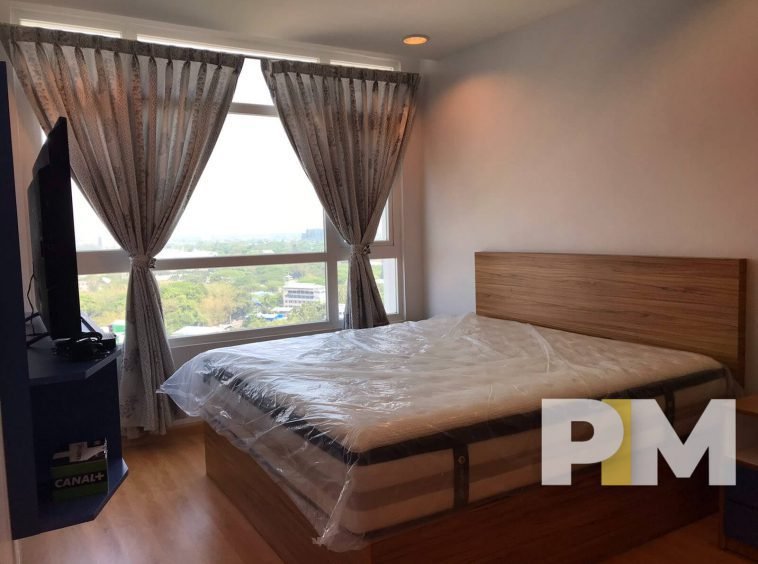 bedroom with bed and mattress - Yangon Property