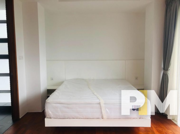 bedroom with bed and mattress - Yangon Property