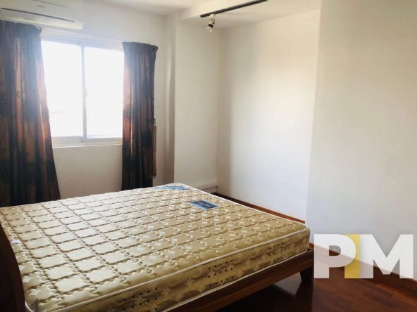 bedroom with bed and mattress - Yangon Real Estate