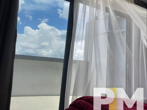bedroom with curtains - Yangon Property