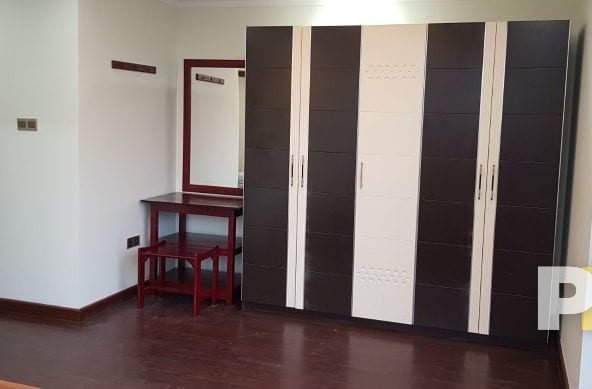 bedroom with vanity mirror - property in Myanmar