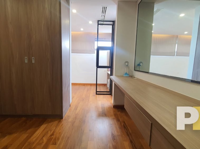 bedroom with vanity mirror - property in Yangon