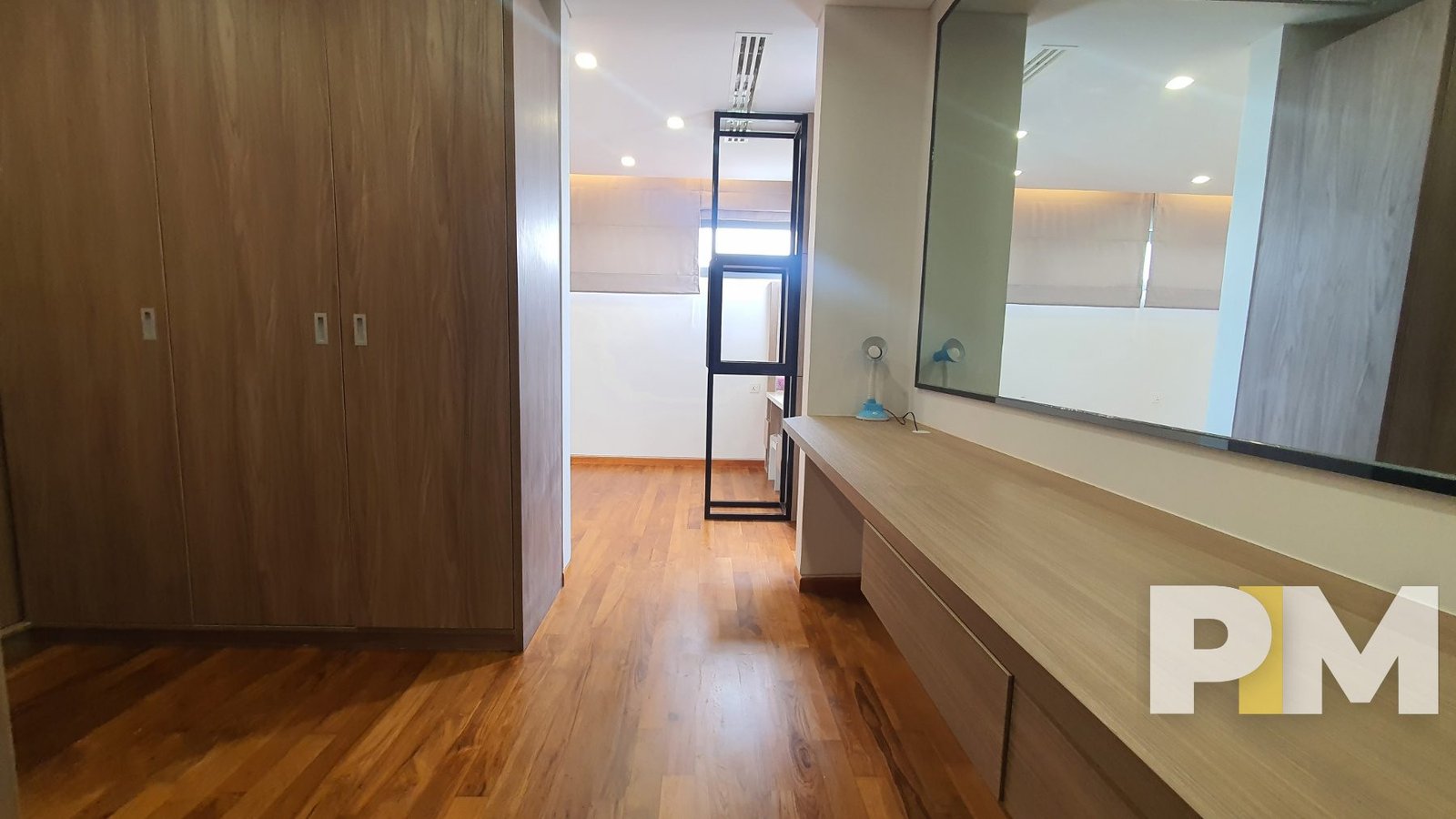 bedroom with vanity mirror - property in Yangon