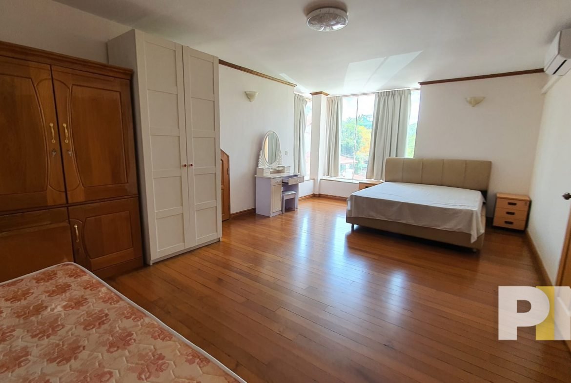 bedroom with vanity mirror - property in Yangon