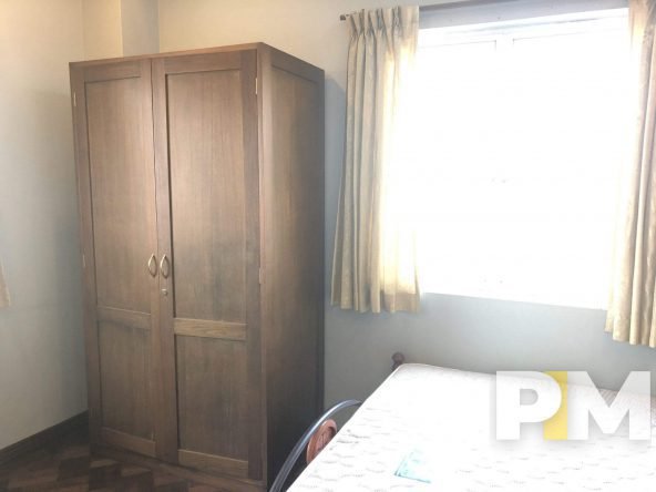 bedroom with wardrobe - Home Rental Yangon