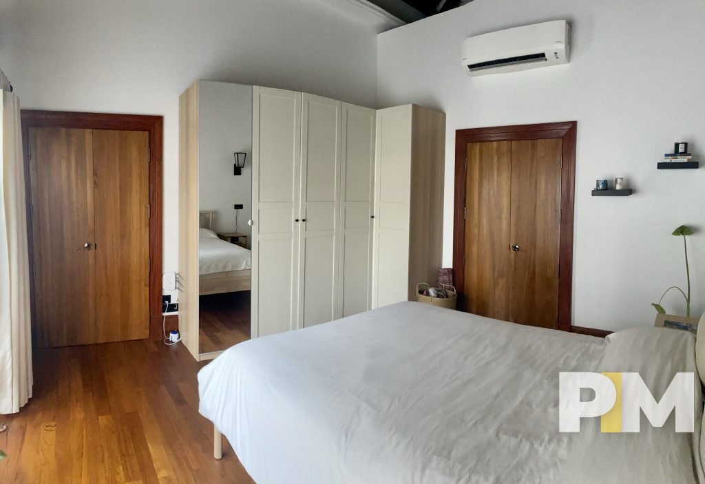 bedroom with wardrobe - property in Yangon