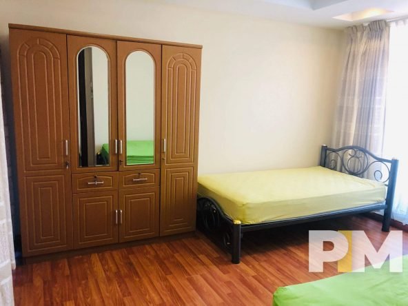bedroom with wardrobe - property in Yangon