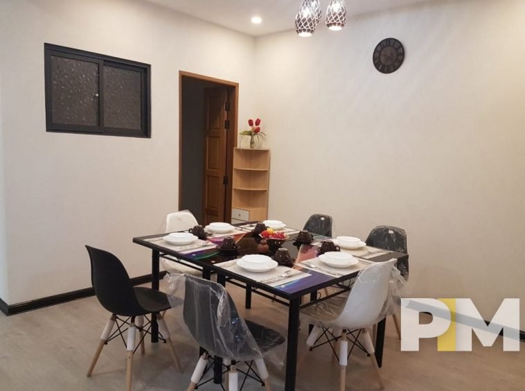 dining room with table and chairs - property in Yangon