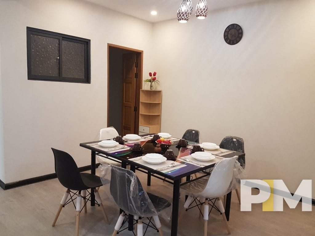 dining room with table and chairs - property in Yangon