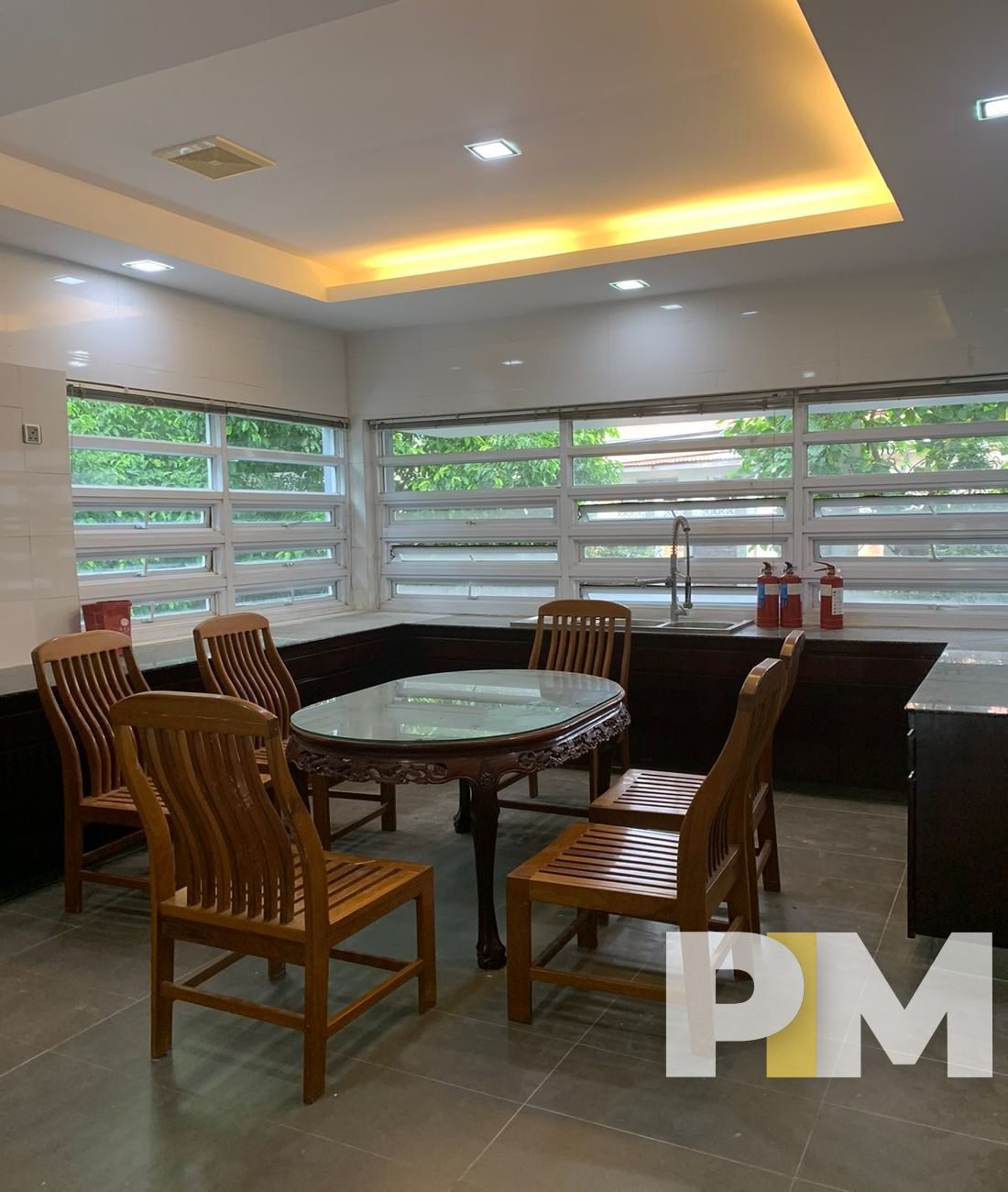 dining space with dining table and chairs - property in Myanmar