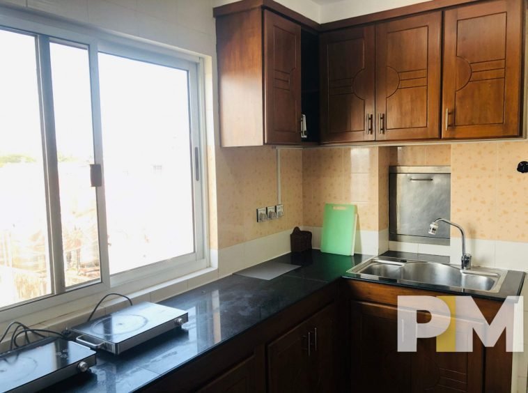 kitchen with cabinets - Condo for rent in Yawmingyi