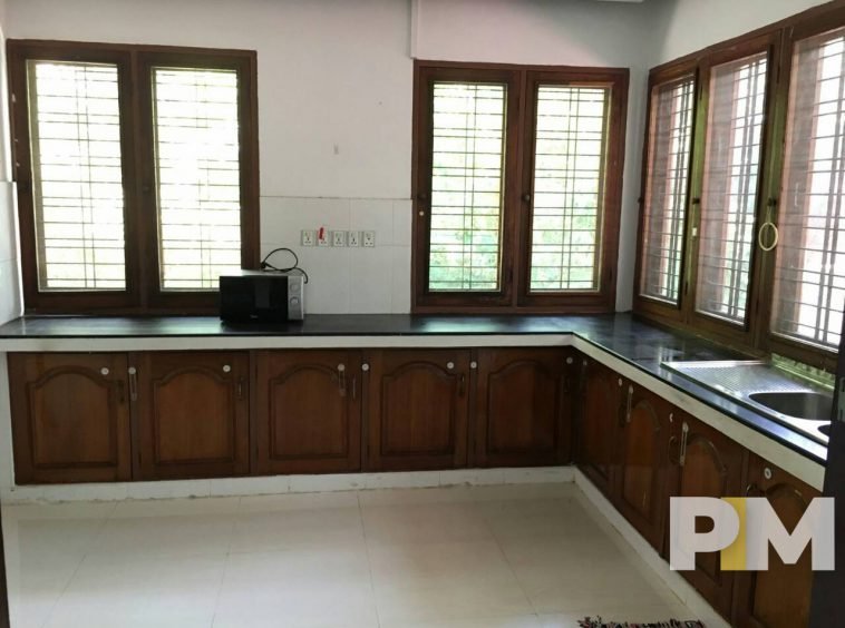 kitchen with cabinets - properties in Yangon