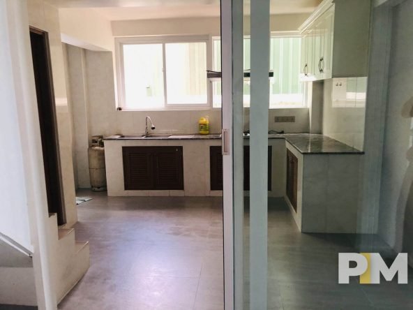 kitchen with cabinets - property in Yangon