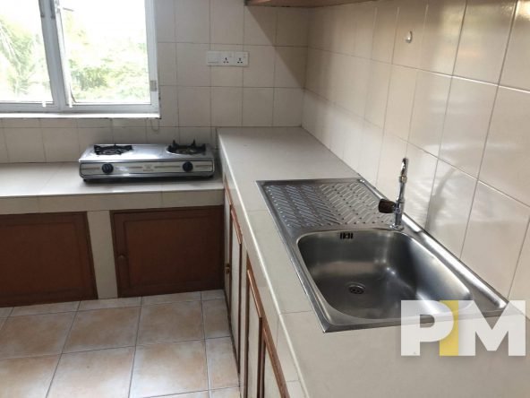 kitchen with electric stove - properties in Yangon